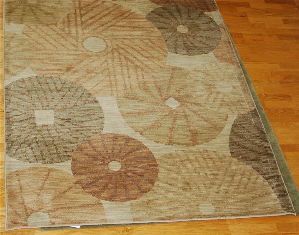 Appraisal: SHAW INDUSTRIES CONTEMPORARY NYLON RUG having an oatmeal field asymmetrical