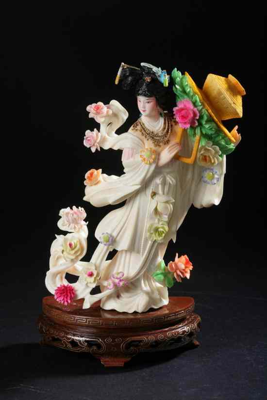 Appraisal: CHINESE POLYCHROME IVORY FIGURE OF A FEMALE IMMORTAL Standing wearing