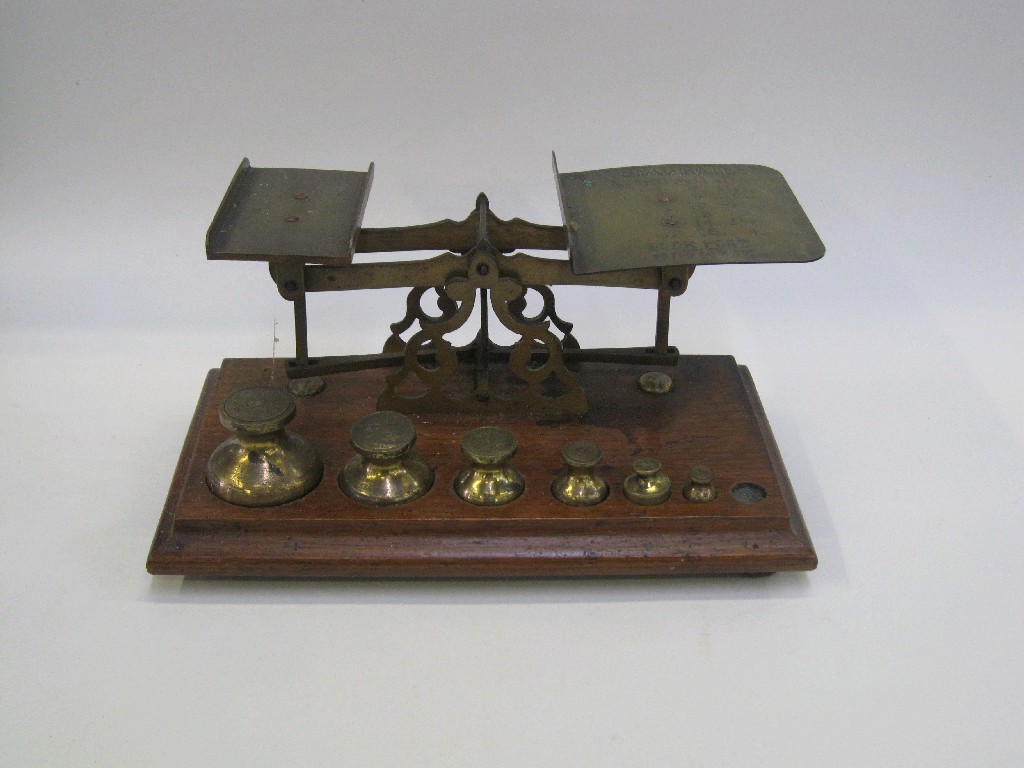 Appraisal: Set of brass postage scales and weights