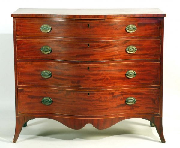 Appraisal: A four drawer chest of drawers of brilliantly figured mahogany