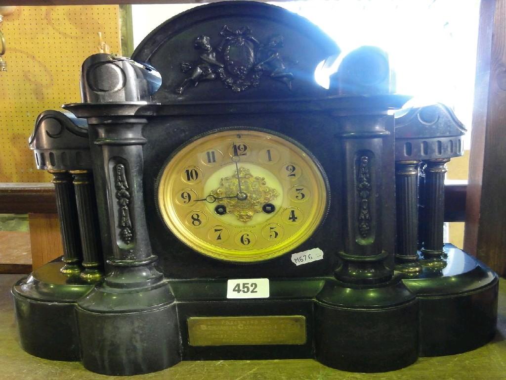 Appraisal: A Victorian black slate classical mantle clock with brass and