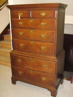 Appraisal: AN OAK CHEST ON CHEST with moulded cornice two short