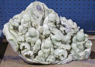 Appraisal: Chinese Soapstone Carving Children Dragon Chinese green soapstone carving featuring