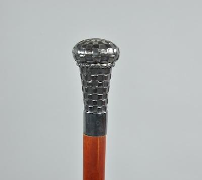 Appraisal: A Walking Stick with Sterling Silver Knob A wooden cane