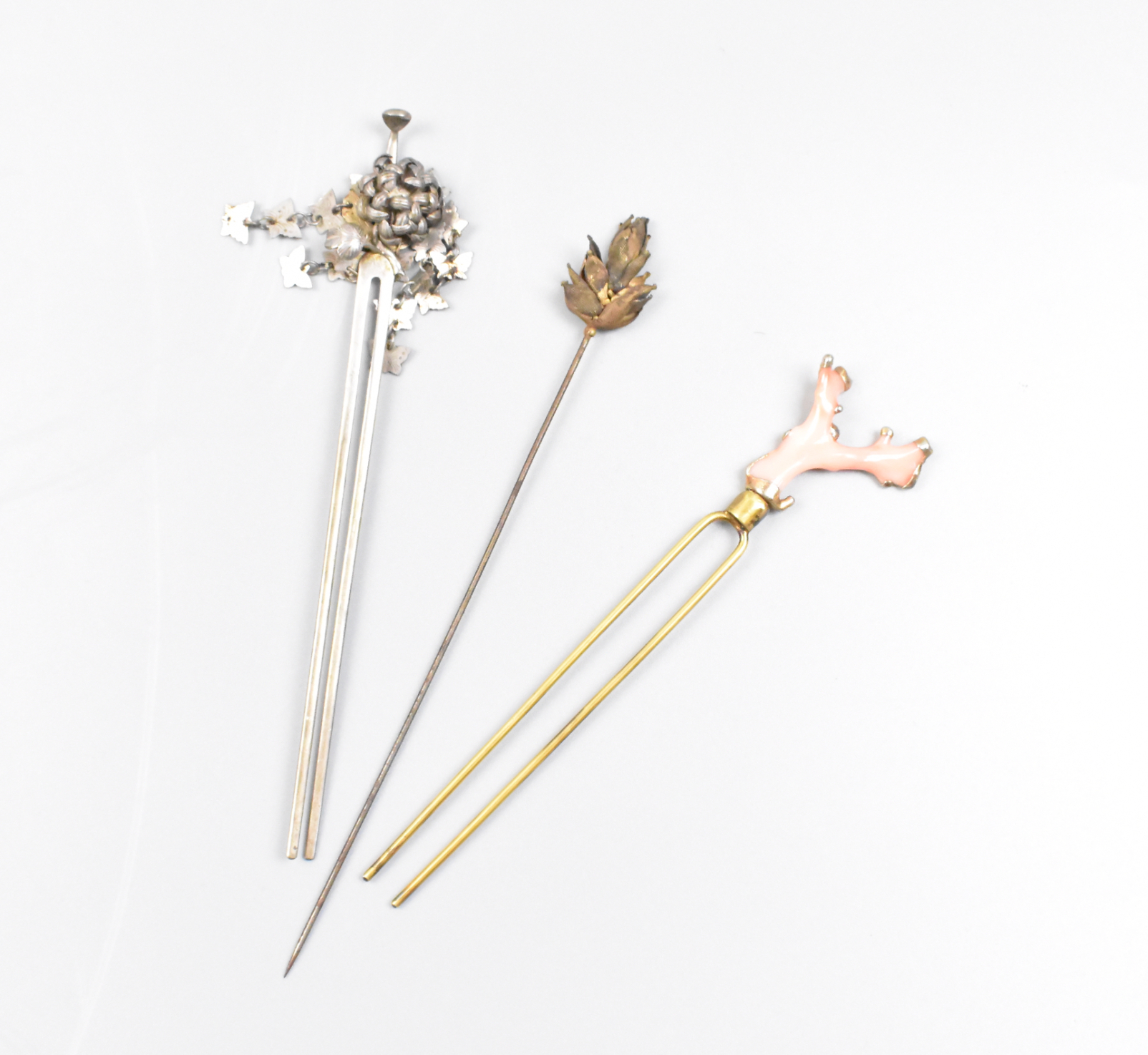 Appraisal: A group of three Chinese gilt silver hairpins one coral