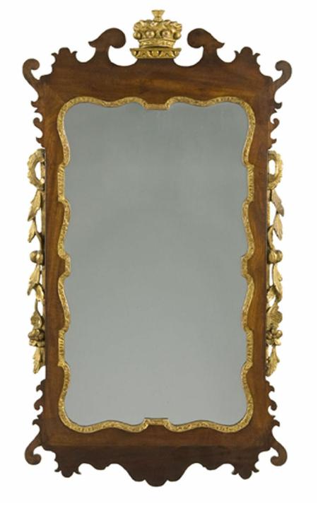 Appraisal: A mahogany and parcel gilt wall mirror the cartouche-shape plate