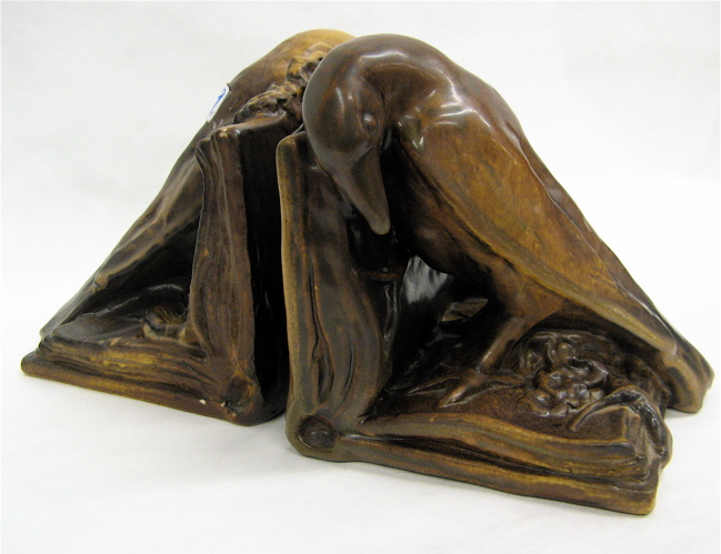 Appraisal: PAIR AMERICAN ROOKWOOD ART POTTERY BOOKENDS figural Rook on an