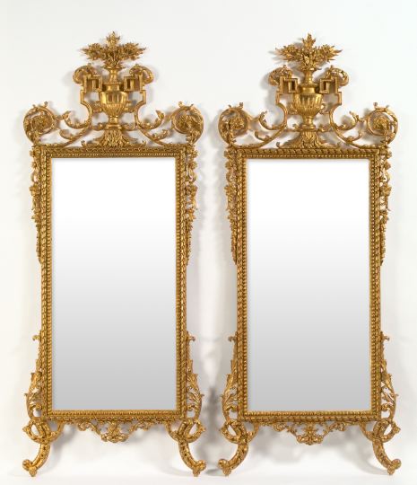 Appraisal: Imposing Pair of Italian Carved Giltwood Looking Glasses in the