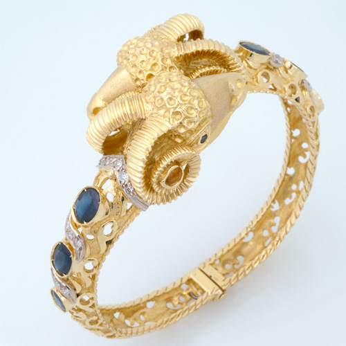 Appraisal: k yg ram's head bypass bracelet with six faceted oval