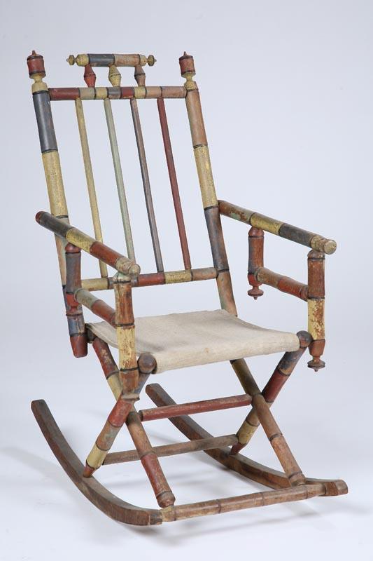 Appraisal: FOLKSY ROCKING CHAIR American late th-early th century mixed woods