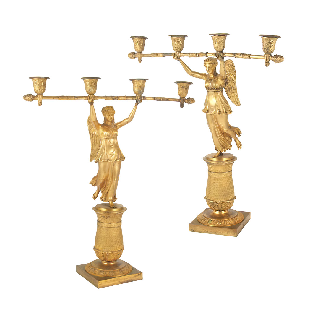 Appraisal: Pair of Empire Gilt-Bronze Four-Light Candelabra Circa Each winged female