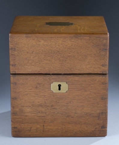 Appraisal: Hinged Top Decanter Box Containing two brown blown glass bottles