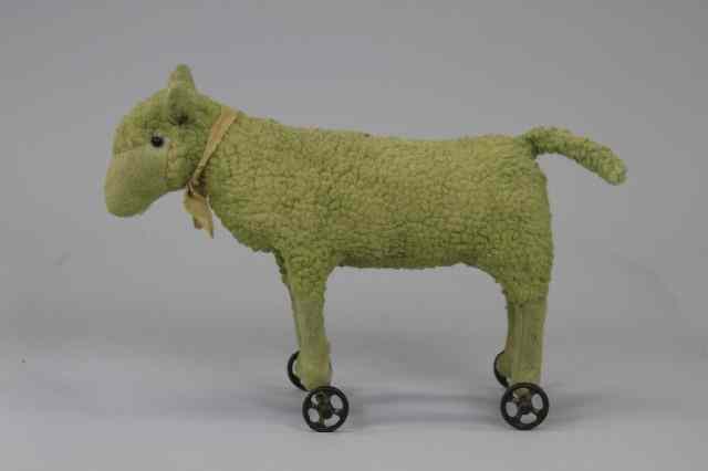 Appraisal: STEIFF LAMB PULL TOY Woolly stuffed Steiff lamb on cast