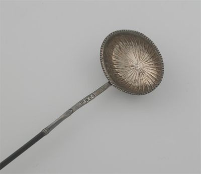 Appraisal: A George III punch ladle with a part-fluted oval bowl