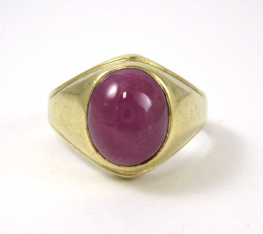 Appraisal: MEN'S STAR RUBY AND FOURTEEN KARAT GOLD RING bezel set