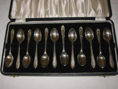 Appraisal: A SET OF TWELVE TEASPOONS the pointed handles bright cut