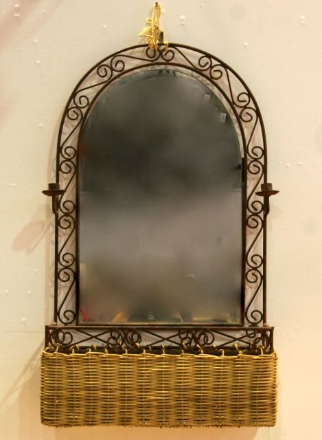 Appraisal: An iron framed Art Nouveau style wall mirror with two