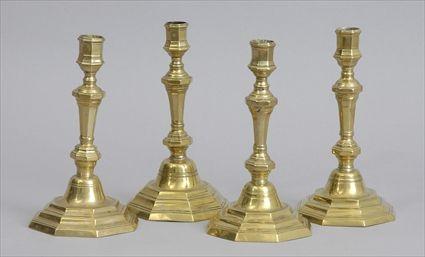 Appraisal: ASSEMBLED SET OF FOUR FRENCH BRASS CANDLESTICKS Each octagonal tapered