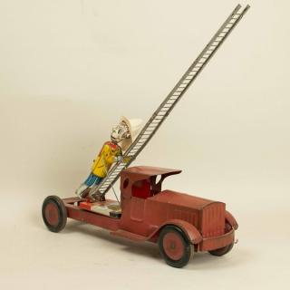 Appraisal: MARX Climbing Fireman Truck MARX tin wind up climbing fireman