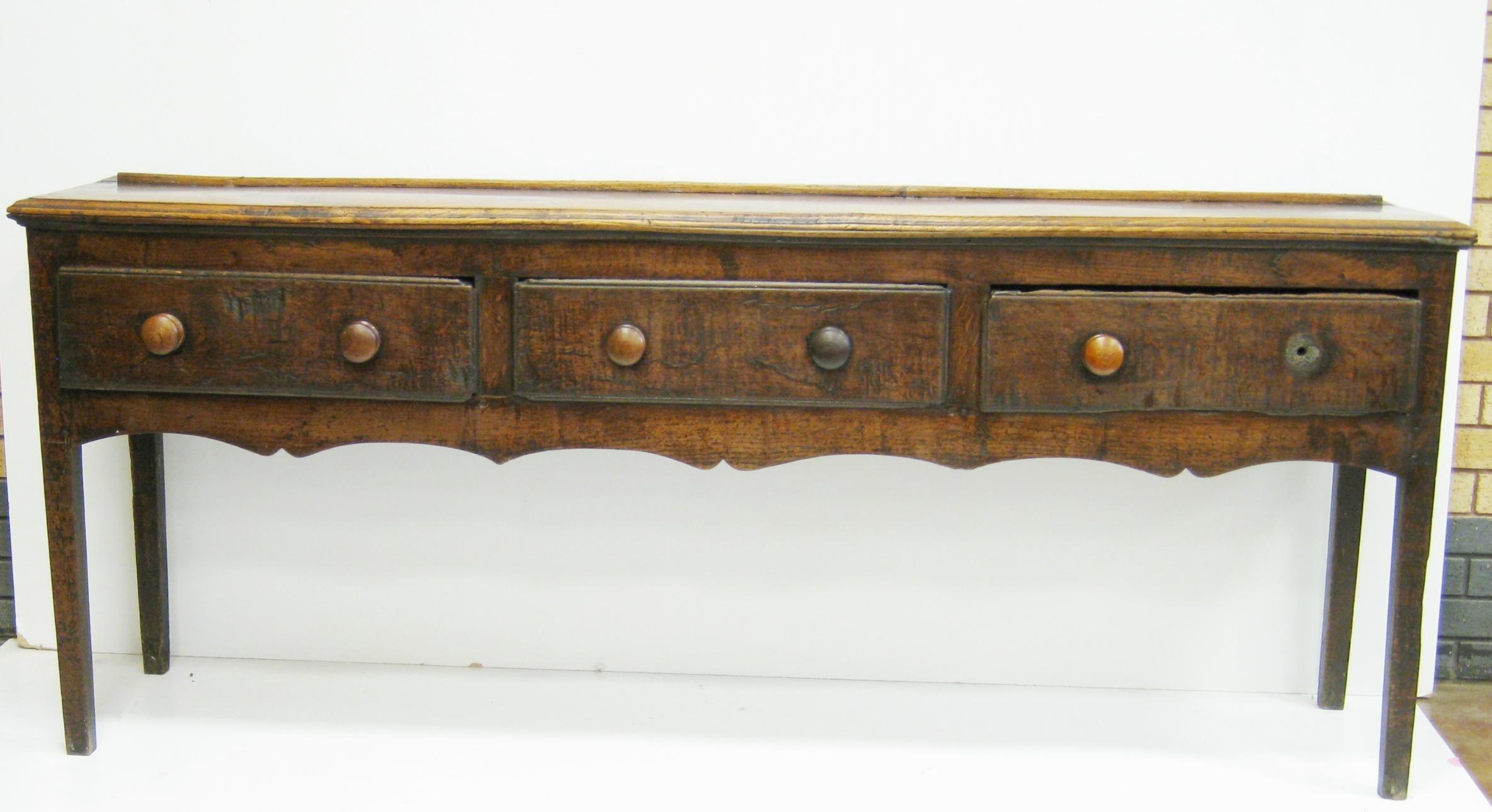 Appraisal: An antique oak and elm Dresser with open rack reduced