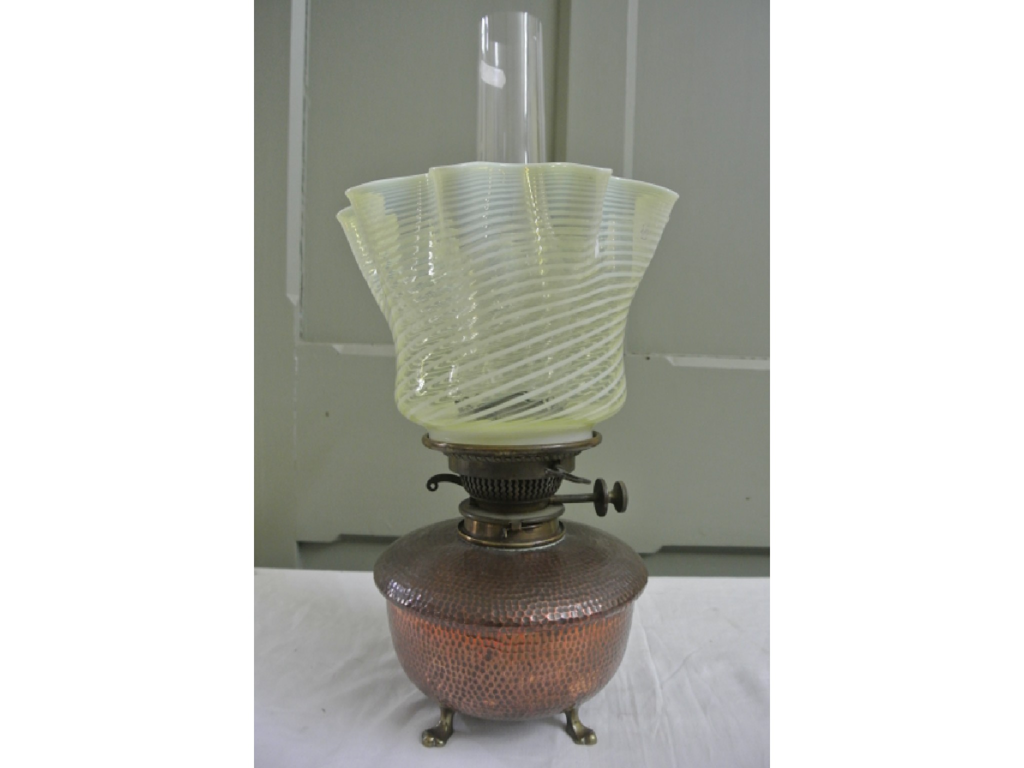 Appraisal: An Arts and Crafts copper oil lamp the base with