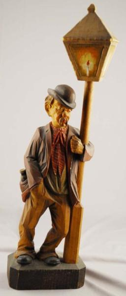 Appraisal: Wooden Carved Whistler Man Standing by Pole Description Working Man