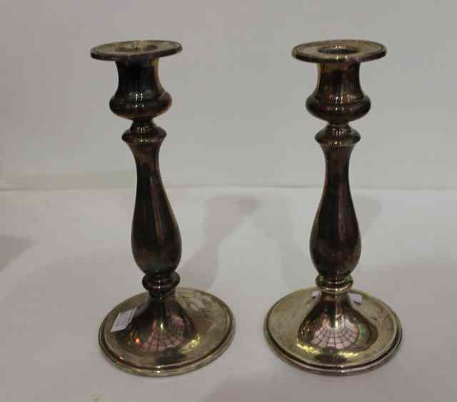 Appraisal: A PAIR OF CONTINENTAL WHITE METAL CANDLESTICKS with circular bases