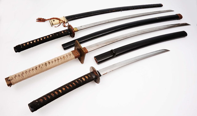 Appraisal: Three Katana Samurai Swordseach with black lacquered and metal scabbards