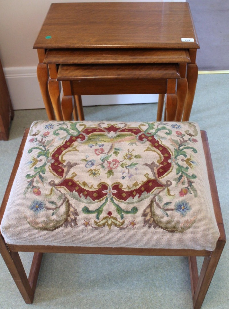 Appraisal: A walnut nest of tables and a tapestry stool