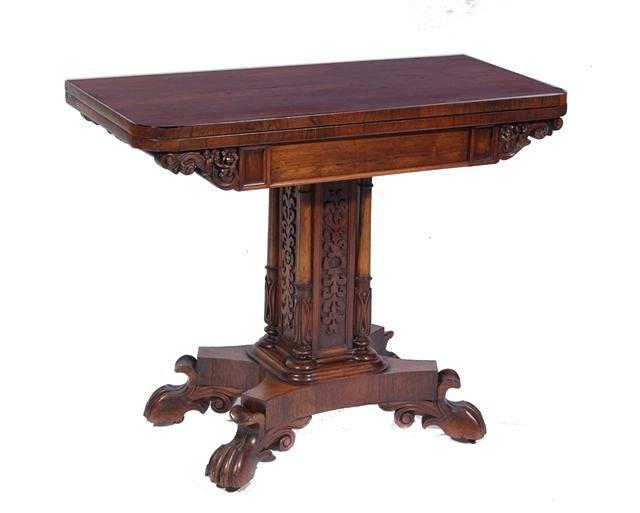 Appraisal: AN EARLY VICTORIAN ROSEWOOD FOLD OVER CARD TABLE with carved