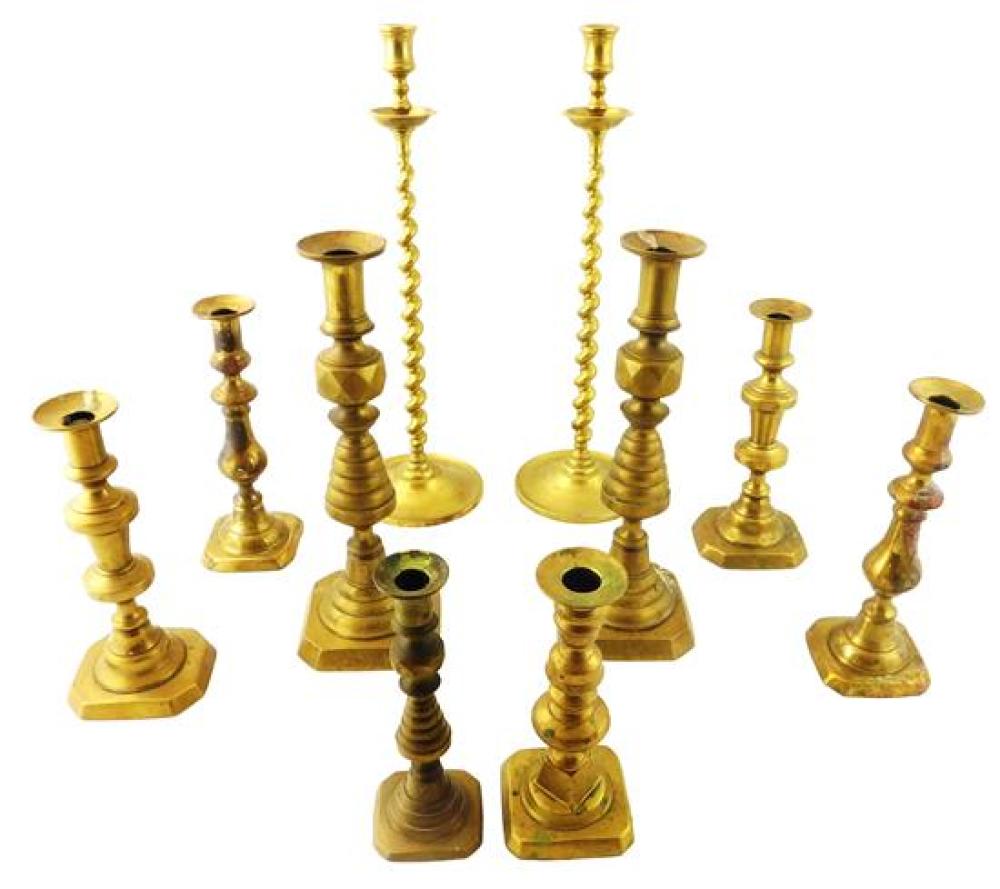 Appraisal: Early brass candlesticks late th th C ten pieces includes