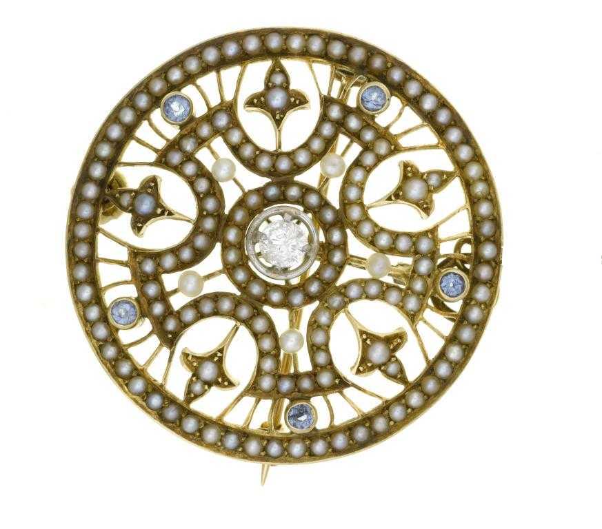 Appraisal: A DIAMOND SAPPHIRE AND SEED PEARL BROOCH of openwork circular