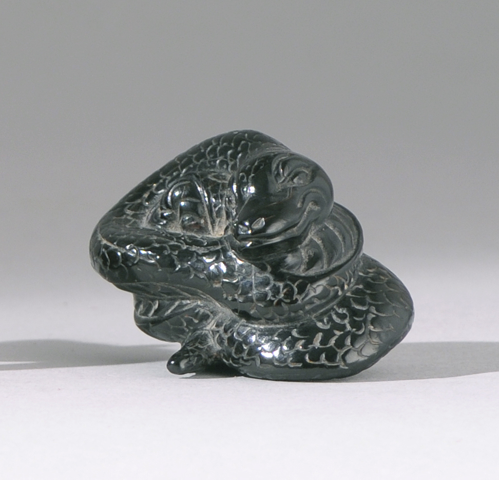 Appraisal: UMIMATSU NETSUKE th CenturyIn the form of a coiled snake