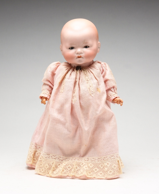 Appraisal: GERMAN BISQUE HEAD DOLL Early th century Pink gown Soft