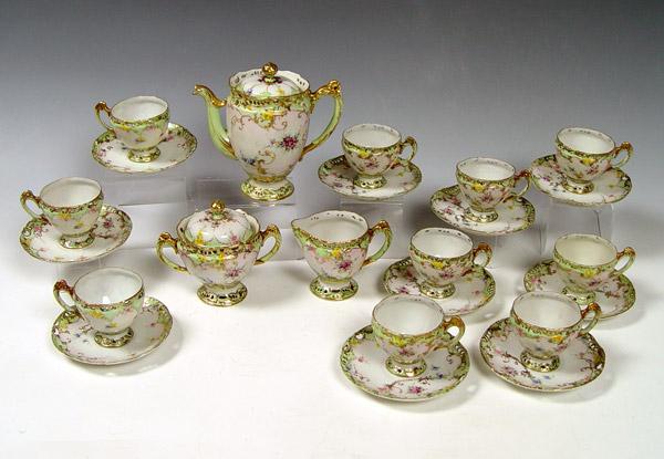 Appraisal: HAND PAINTED FRENCH PORCELAIN COFFEE SET Petite coffee pot with