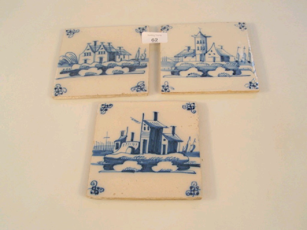 Appraisal: Three thC blue Delft tiles painted with scenes of buildings