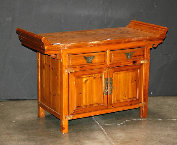 Appraisal: Three small soft wood console cabinets with scrolled top panels