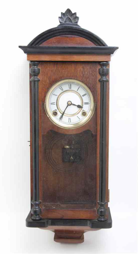 Appraisal: An American Walnut Regulator Clock having a brass dial with