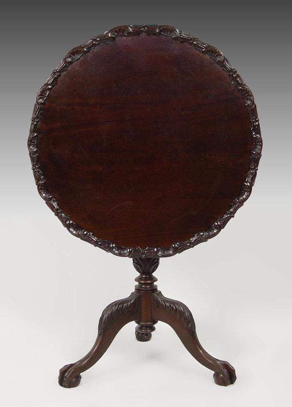 Appraisal: VICTORIAN CHIPPENDALE STYLE TILT TOP TABLE Mahogany shell carved edge