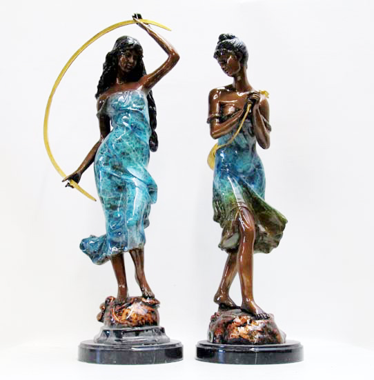 Appraisal: TWO BRONZE FIGURAL SCULPTURES each depicting a posed standing woman