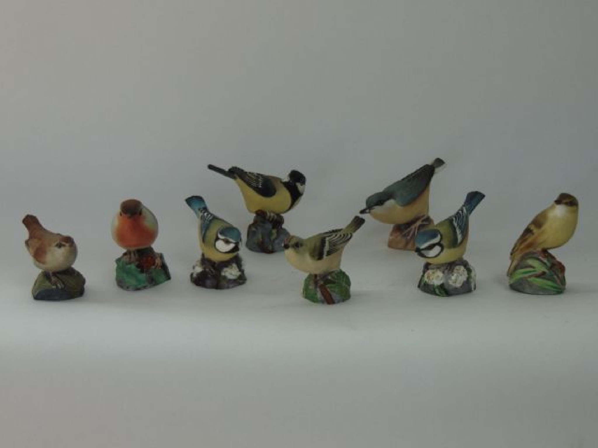 Appraisal: A collection of six Royal Worcester matt glazed model birds