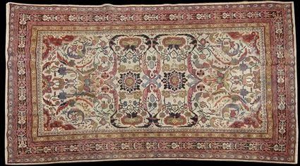 Appraisal: PERSIAN IVORY-GROUND SMALL CARPET Worked with stylized flowers and leafage