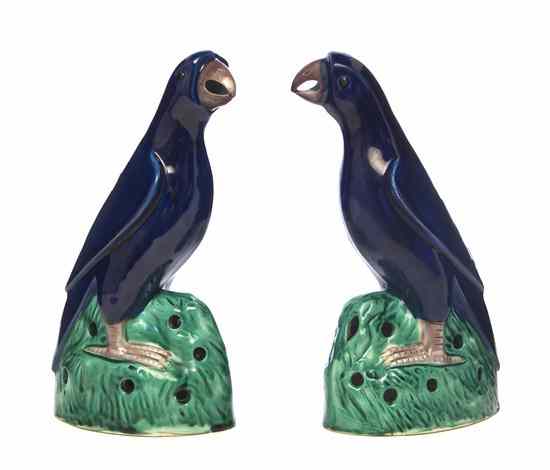 Appraisal: A Pair of Chinese Porcelain Parrots having cobalt glaze throughout