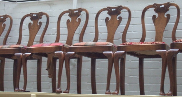 Appraisal: A set of six th century walnut framed dining chairs