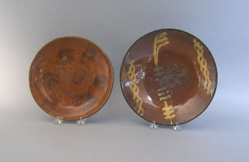 Appraisal: Two Pennsylvania redware pie plates th c dia and dia