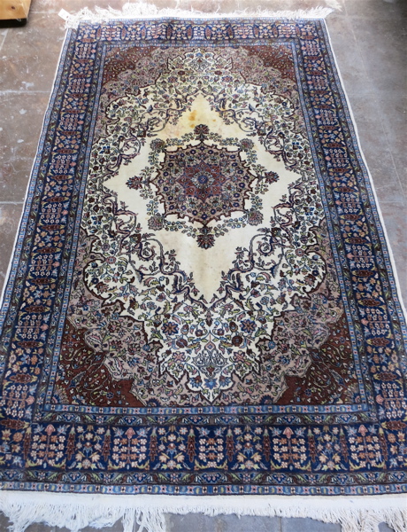 Appraisal: HAND KNOTTED ORIENTAL CARPET Pakistani Persian floral and floral medallion