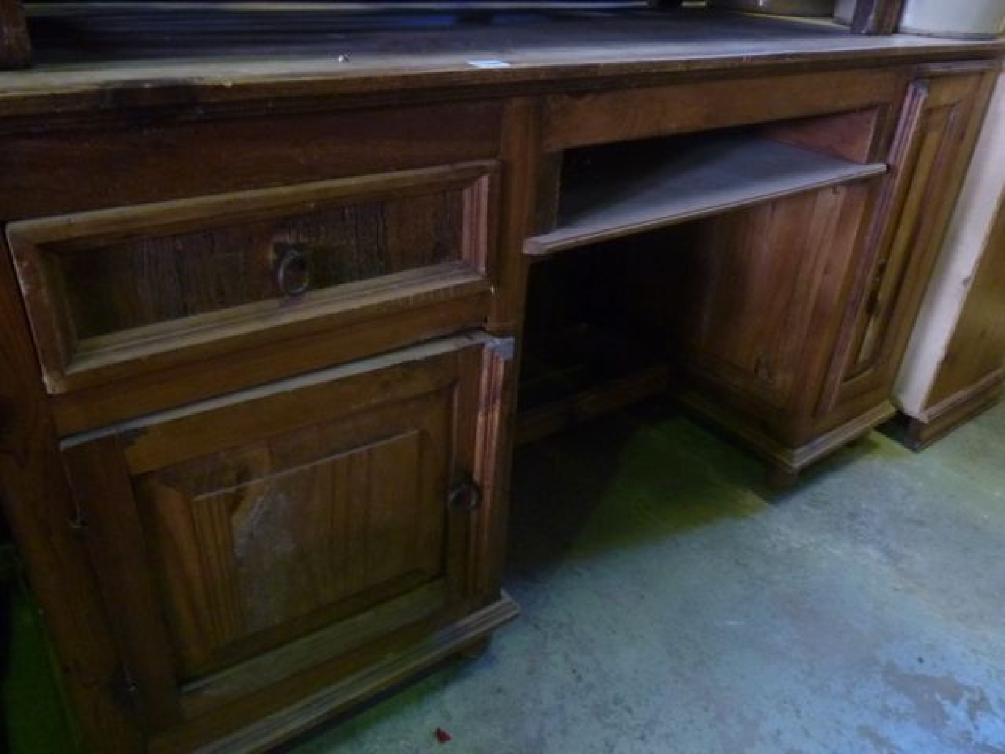 Appraisal: A Mexican pine kneehole pedestal desk partially enclosed by a