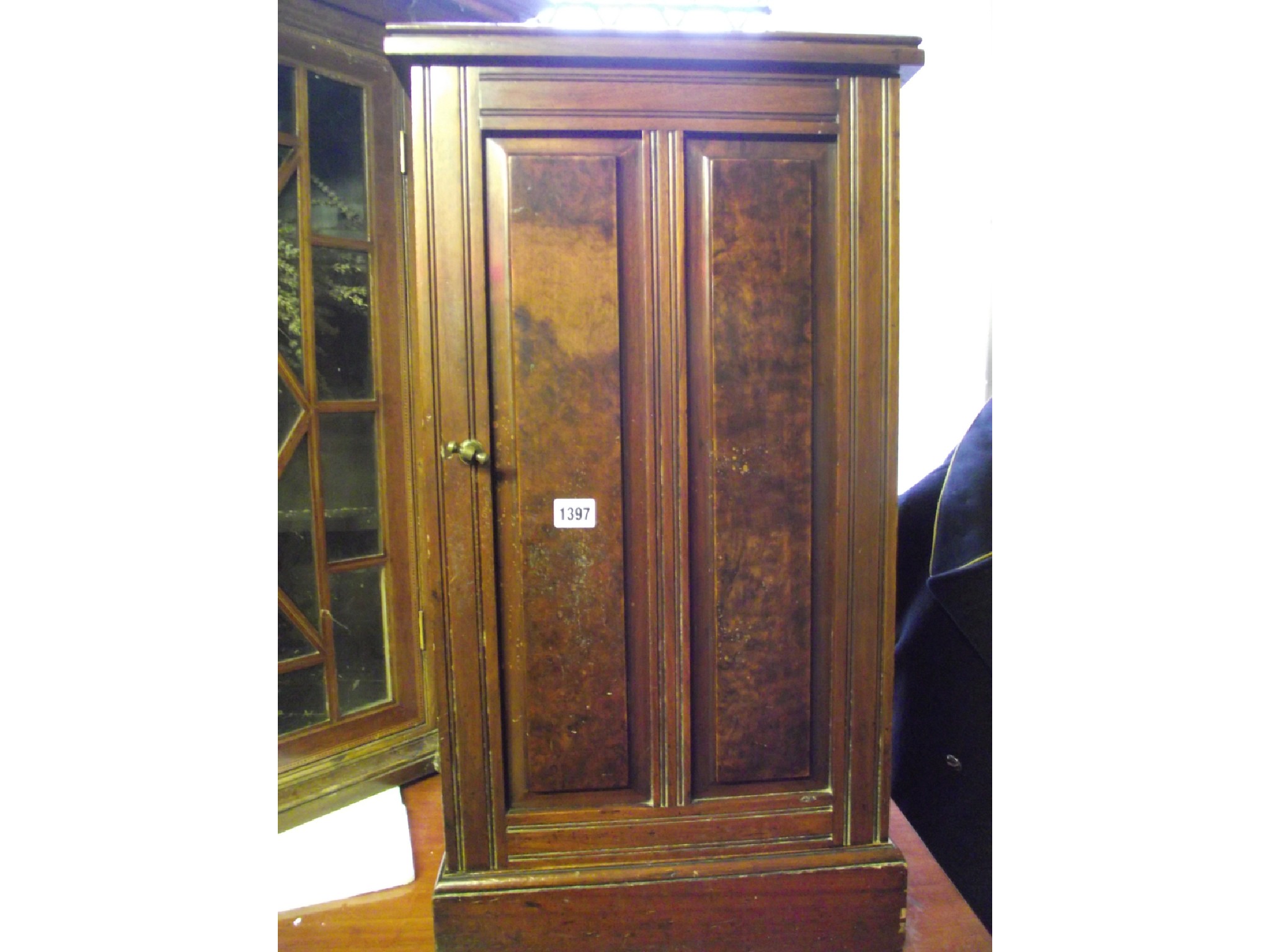 Appraisal: A late Victorian walnut bedside cupboard with moulded plinth and