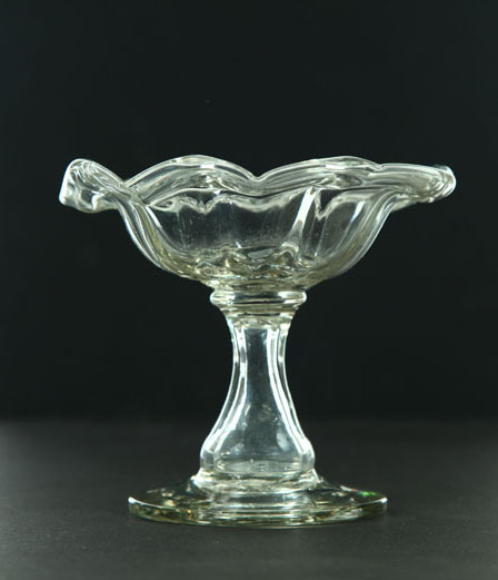 Appraisal: BLOWN GLASS FOOTED DISH American st half- th century Clear