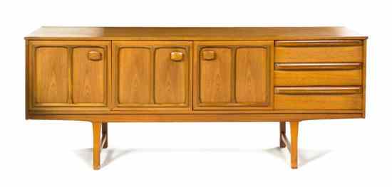 Appraisal: A Danish Mid-Century Modern Sideboard of rectangular form having three